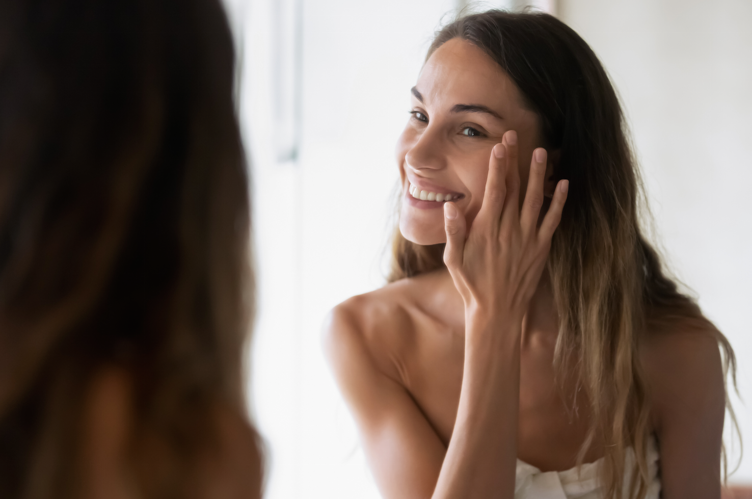 Woman looking at her skin